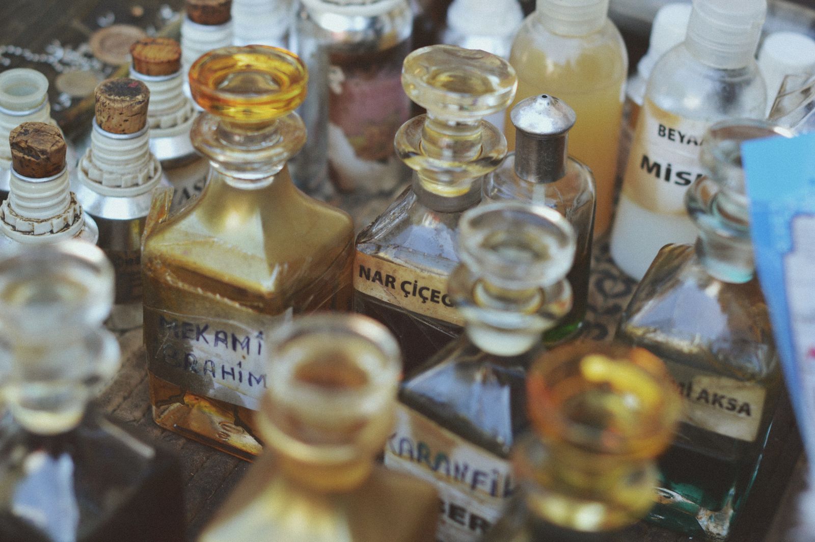 A close look at a collection of vintage fragrance bottles and their labels